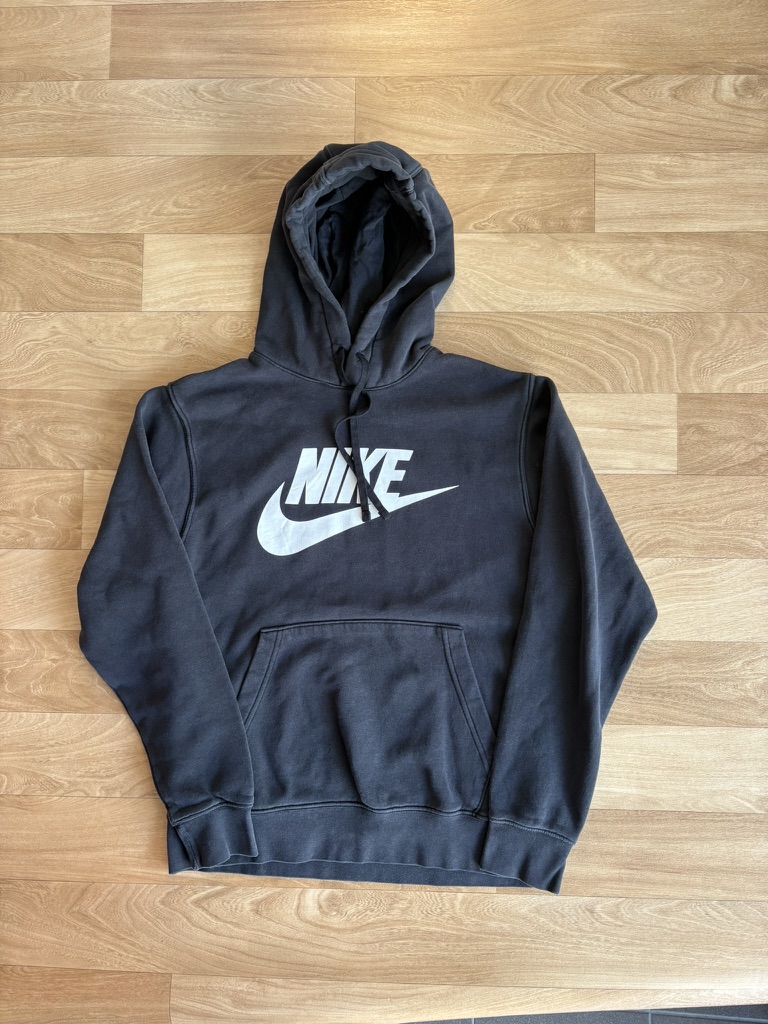 Nike hoodie — bunched on the floor vs. laid out, hood shaped, logo square to camera. — after